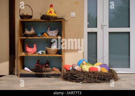 easter decorations outside of rural village culture house promoting upcoming holiday lentikapolna zala county hungary Stock Photo