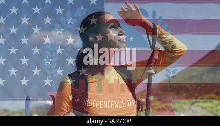 Image of independence day text over biracial woman looking away in mountains Stock Photo