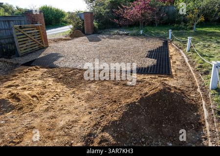 Installation of gravel grid on a driveway to stop movement of stones. Stock Photo