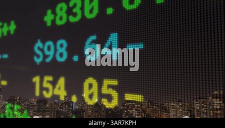 Composite image of stock market data processing against cityscape at night Stock Photo