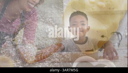 Image of happy african american mother and son baking over dough and cookies Stock Photo