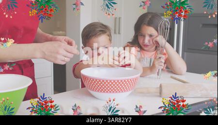 Image of flower icons over caucasian mother with happy children baking Stock Photo