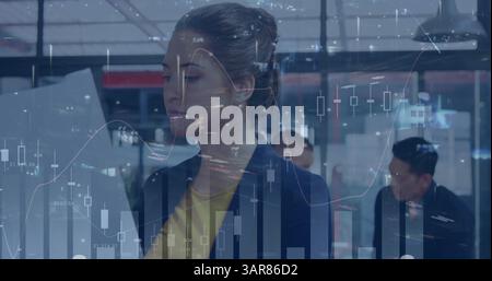 Image of statistics and data processing over businesswoman Stock Photo