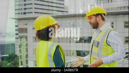 Image of statistics processing over male and female architects talking at construction site Stock Photo