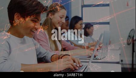 Image of mathematical equations over school children using laptops in classroom Stock Photo