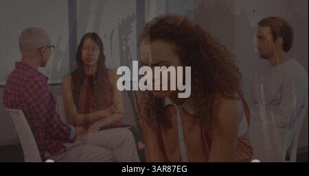 Textured scratched overlay against stressed african american woman holding her head at office Stock Photo