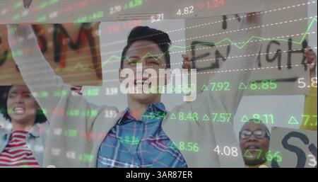 Stock market data processing against group of diverse people protesting Stock Photo