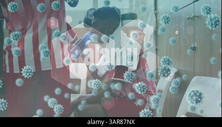 Image of medical icons and virus cells over diverse football players Stock Photo