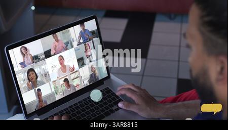 Multiple blank speech bubbles against rear view of biracial man having a image conference on laptop Stock Photo