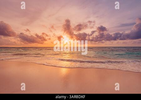 Closeup views sea sand inspire serenity in perfect island scene. Fantastic sky sunset sunlight calm waves stunning beach landscape. Beautiful nature Stock Photo
