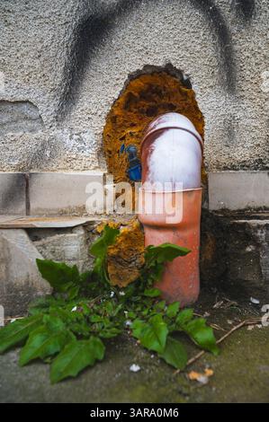 requires repair work neglected sloppy work tears, holes cracked concrete quick and dirty job Stock Photo