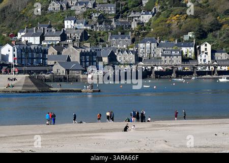 Barmouth seaside town Gwynedd, north-west Wales with people on the beach at Fairbourne on the opposite side of the estuary. Stock Photo