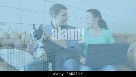 Composite image of statistical data processing over caucasian couple calculating finance together Stock Photo