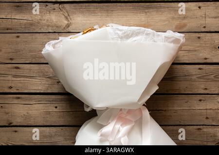 Large white bouquet with roses on the table, bouquet of roses Stock Photo