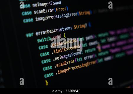 Swift programming code on a dark screen displaying enum cases and switch statement logic used for structured error handling and returning descriptions Stock Photo
