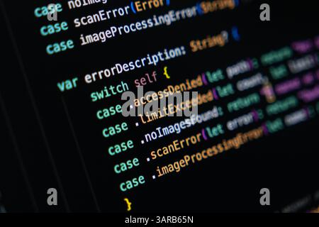 Close-up of Swift programming code on a dark screen highlighting enum-based error handling logic using switch cases and returning descriptions for dif Stock Photo