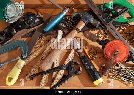 Assorted tools on work bench Stock Photo