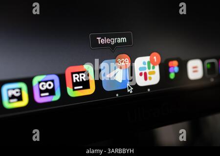 Poznan, Poland – April 14, 2025: Close-up of Telegram application icon highlighted in macOS Dock, showing unread messages as a popular encrypted commu Stock Photo
