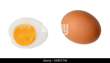 Top view set of one raw brown chicken eggs and one boiled or cooked eggs in a half with egg yolk is isolated on white background with clipping path. Stock Photo
