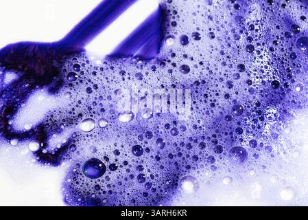 Violet blonde dye hair shampoo texture isolated on white background. Swatch of purple cooling shampoo or conditioner for blond hair. Stock Photo