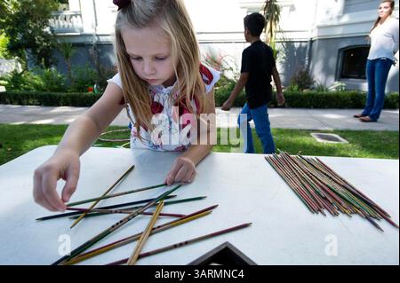 Sept. 27, 2013 - Modesto, California, U.S. - Kacy Thurman, 8, plays a game of Pick Up Sticks during the McHenry Mansion's 130th anniversary open house celebration on Saturday, September 28, 2013. (Credit Image: © Andy Alfaro Aalfaro@Modbee.Com/Modesto Bee/ZUMAPRESS.com) Stock Photo