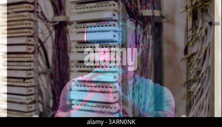 Image of men using vr headset over server room Stock Photo