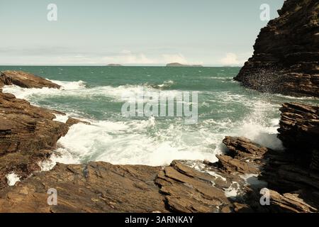 Waves hitting rocks in Buzios, Brazil Stock Photo