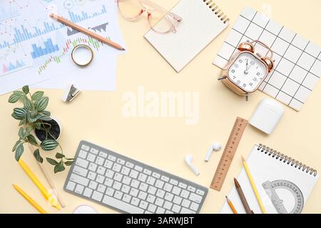 Frame made of different stationery, gadgets, financial documents and alarm clock on color background Stock Photo