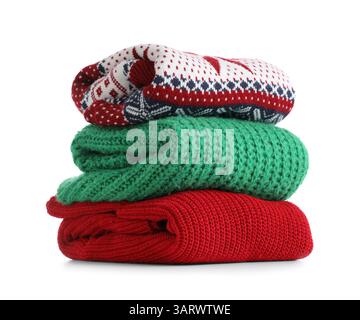 Stack of clean sweaters isolated on white background Stock Photo
