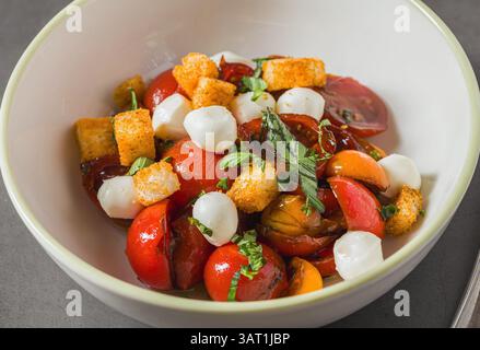 Top view of Italian Panzanella salad on grey stone table Stock Photo