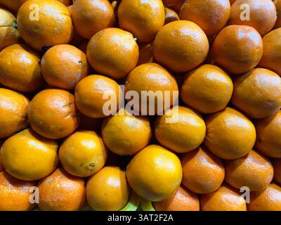 Fresh oranges bright orange color on store counter in natural light without artificial light top view. High quality photo Stock Photo