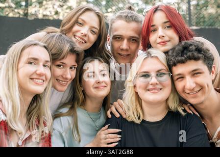 Group of diverse smiling friends enjoying time together Stock Photo