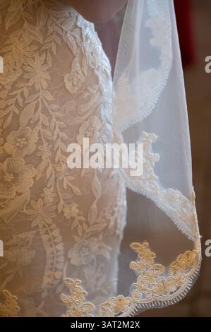 Delicate Lace Detail on Bridal Veil and Gown for Wedding Ceremon Stock Photo