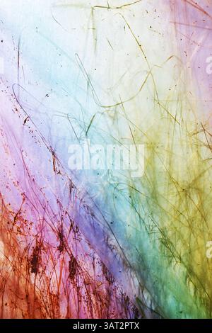 Blurred photo of grass and plants behind the foil, abstract background. Stock Photo