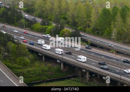 Great Barr, Birmingham, April 18th 2025. An unfortunate holidaymaker has broken down with their caravan waiting for a recovery truck on the southbound carriageway of the M5 motorway near Birmingham. - Good Friday traffic is building close to Junction 8 of the M5 and M6 motorway Interchange near Great Barr, Birmingham as motorists getaway on Good Friday. The M5 motorway (pictured) joins the M6 at Junction 8 northbound towards Wolverhampton and Southbound towards London. Credit: British News and Media/Alamy Live News Stock Photo