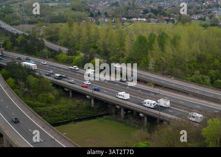 Great Barr, Birmingham, April 18th 2025. An unfortunate holidaymaker has broken down with their caravan waiting for a recovery truck on the southbound carriageway of the M5 motorway near Birmingham. - Good Friday traffic is building close to Junction 8 of the M5 and M6 motorway Interchange near Great Barr, Birmingham as motorists getaway on Good Friday. The M5 motorway (pictured) joins the M6 at Junction 8 northbound towards Wolverhampton and Southbound towards London. Credit: British News and Media/Alamy Live News Stock Photo