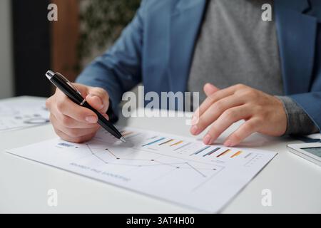 Man Analyzing Data Report Stock Photo