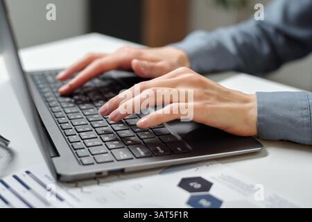 Female Hands Typing on Keyboard in Office Stock Photo