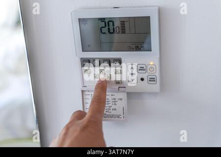 Heraklion , Greece - October 17, 2024: Interactive Home Climate Control: Adjusting Settings on a Digital Thermostat for Optimal Comfort. Stock Photo
