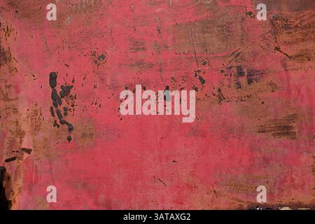Old corroded scratched rusted textured red metal surface background Stock Photo