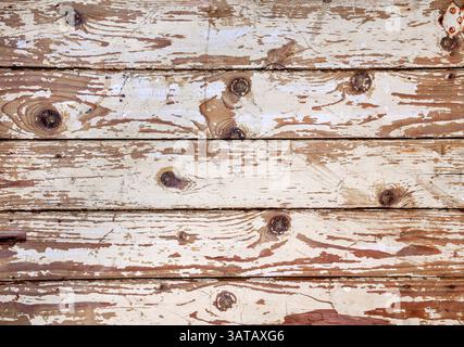 Old wooden boards background with peeling white paint Stock Photo