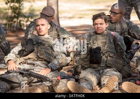 Men and women soldiers at basic combat training rest during boot camp ...
