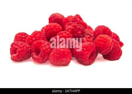 Heap of raspberries on white isolated background Stock Photo