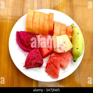 Plate of delicious tropical fruits Stock Photo