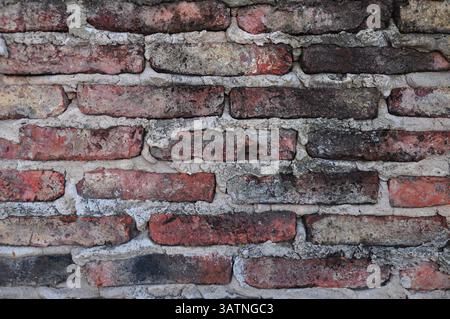 Corroded brick wall with signs of burn marks Stock Photo