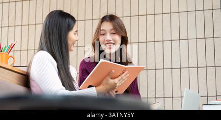 Friendship and Study Sessions. Two college students collaborating on their projects over coffee. Stock Photo