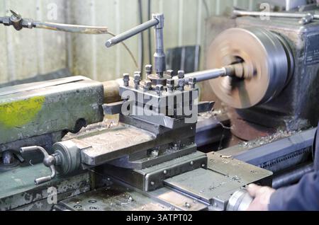 An operator works at a metal working machine Stock Photo