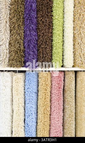 Different colourful artificial shaggy carpet samples, closeup Stock Photo