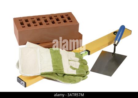 Bricklayer's tools with building materials - isolated on white background Masons equipment with bricks and sand - isolated on white background Stock Photo