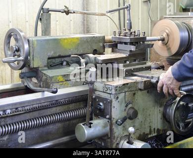 An operator works at a metal working machine Stock Photo